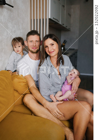 Cozy Family Portrait With Newborn And Child Cozy Family Portrait With Newborn And Child 132022092