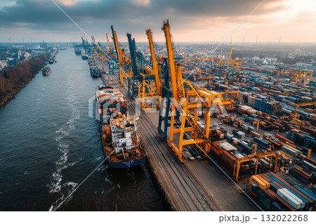 Aerial view showcasing a bustling port with container ships, gantry cranes, and a massive container terminal, emphasizing global trade and maritime transport Aerial view showcasing a bustling port with container ships, gantry cranes, and a massive container terminal, emphasizing global trade and maritime transport 132022268