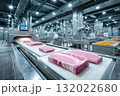 In a modern food processing plant, fresh meat travels along a conveyor belt system, part of an efficient food industry production line 132022680