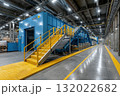 In a factory, an advanced industrial machine, featuring prominent stairs and a conveyor belt, stands as a testament to manufacturing and production capabilities 132022682
