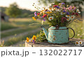 Rustic Flower Vase in Sunlit Garden.Turquoise watering can with wildflowers on grass, glowing in warm sunlight. Perfect for spring, nature, and romantic themes. Rustic Flower Vase in Sunlit Garden.Turquoise watering can with wildflowers on grass, glowing in warm sunlight. Perfect for spring, nature, and romantic themes. 132022717