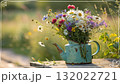Rustic Flower Vase in Sunlit Garden.Turquoise watering can with wildflowers on grass, glowing in warm sunlight. Perfect for spring, nature, and romantic themes. Rustic Flower Vase in Sunlit Garden.Turquoise watering can with wildflowers on grass, glowing in warm sunlight. Perfect for spring, nature, and romantic themes. 132022721