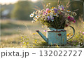 Rustic Flower Vase in Sunlit Garden.Turquoise watering can with wildflowers on grass, glowing in warm sunlight. Perfect for spring, nature, and romantic themes. Rustic Flower Vase in Sunlit Garden.Turquoise watering can with wildflowers on grass, glowing in warm sunlight. Perfect for spring, nature, and romantic themes. 132022727