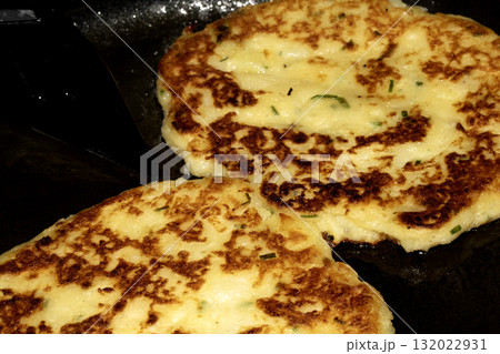 CLose up of fried potato cake fritter toasted brown tasty 132022931