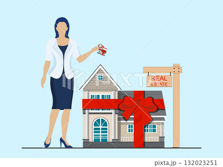 Real estate agent holding a house key for property business. Real estate agent holding a house key for property business. 132023251