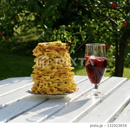 Golden brown Sakotis, a traditional Lithuanian tree cake, 132023658