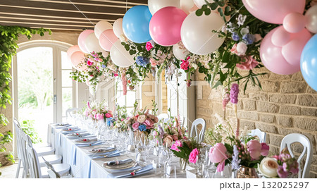 Birthday table decoration with sweets, flowers, candles and pink balloons. 132025297