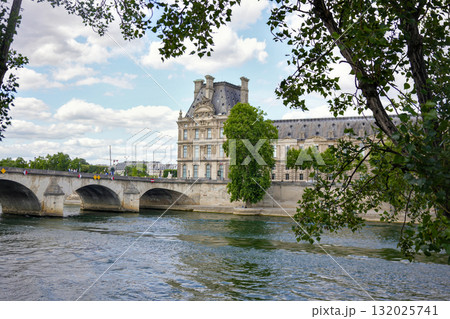 Louvre Museum and Pont Royal bridge over the Seine River in Paris, France 132025741