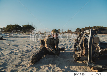 Military Soldier Is In Pain On The Beach After A Fight 132025999