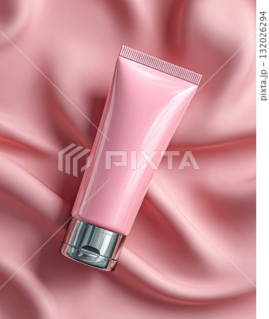 Pink cosmetic tube on silky fabric background with soft light 132026294
