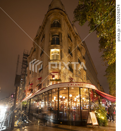 Charming Paris restaurant at night with warm lights and inviting ambiance 132026874