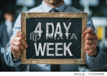Ai generated man employee holding a sign with writing 4 day week standing in office Ai generated man employee holding a sign with writing 4 day week standing in office 132026966