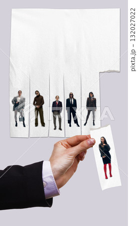 Creative composition. Hand selecting candidate strip from creative paper sheet of applicants Creative composition. Hand selecting candidate strip from creative paper sheet of applicants 132027022