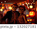 Young couple with scary skeleton makeup celebrating Halloween party 132027181