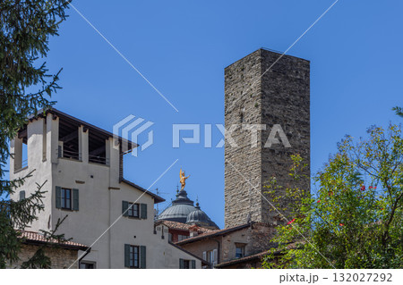 Torre del Gombito rises above Bergamo roofs near dome of Santa Maria Maggiore with angel Torre del Gombito rises above Bergamo roofs near dome of Santa Maria Maggiore with angel 132027292