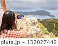 Woman taking photos of city of Kas in Turkey 132027442