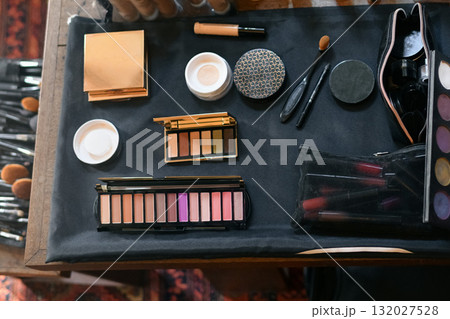 Cosmetics on the table lipstick foundation brush shadow 132027528