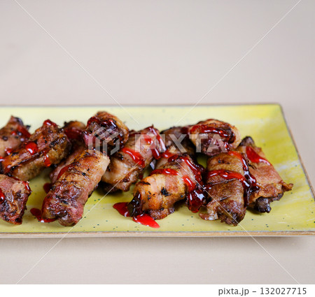 Grilled bacon wraps pork mince with bacon wrapped sausages. top view. copy space for text. 132027715