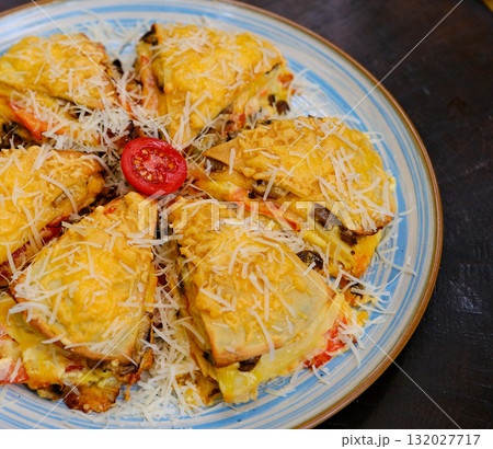 Homemade casserole with chicken, cheese, rice and parsley flakes 132027717
