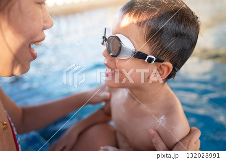 Happy Child And His Mother In Pool Embracing Joyful Connection Together Happy Child And His Mother In Pool Embracing Joyful Connection Together 132028991