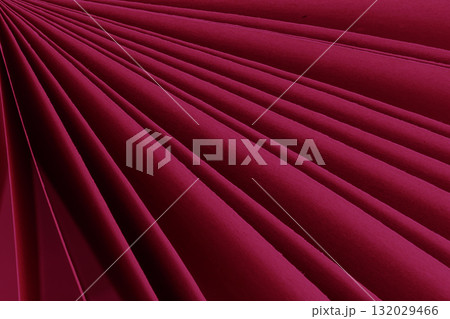 Fanned raspberry pink paper sheets, diagonal lines and dramatic shadows, clean geometric folds. Concept of color paper, color of year, abstract magenta background, modern design Fanned raspberry pink paper sheets, diagonal lines and dramatic shadows, clean geometric folds. Concept of color paper, color of year, abstract magenta background, modern design 132029466