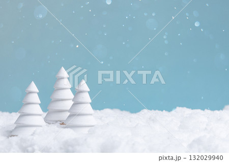 minimalist winter landscape with snow, serene snowy scene with gentle snowfall and blue sky 132029940