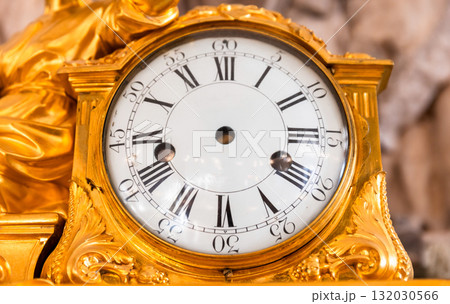 A gilded, intricately designed clock with no movement 132030566