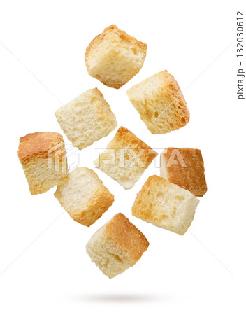 Bread croutons flying close-up on a white. Isolated 132030612