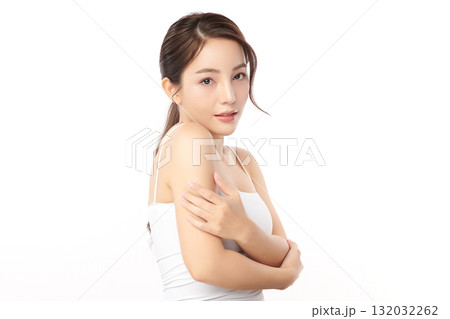 A beautiful young Asian woman with clean, fresh skin against a white background. Skincare, facial treatment, cosmetology, beauty, and spa. An elegant portrait of an Asian woman. 132032262