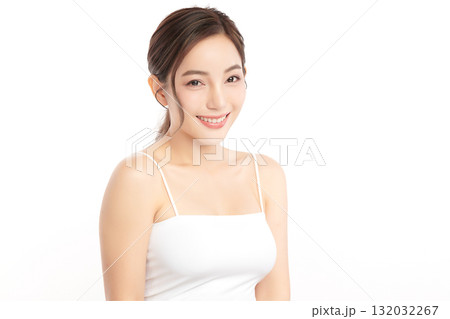 A beautiful young Asian woman with clean, fresh skin against a white background. Skincare, facial treatment, cosmetology, beauty, and spa. An elegant portrait of an Asian woman. A beautiful young Asian woman with clean, fresh skin against a white background. Skincare, facial treatment, cosmetology, beauty, and spa. An elegant portrait of an Asian woman. 132032267
