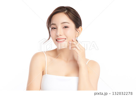A beautiful young Asian woman with clean, fresh skin against a white background. Skincare, facial treatment, cosmetology, beauty, and spa. An elegant portrait of an Asian woman. A beautiful young Asian woman with clean, fresh skin against a white background. Skincare, facial treatment, cosmetology, beauty, and spa. An elegant portrait of an Asian woman. 132032278