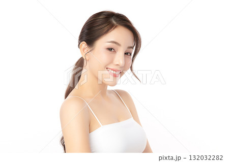 A beautiful young Asian woman with clean, fresh skin against a white background. Skincare, facial treatment, cosmetology, beauty, and spa. An elegant portrait of an Asian woman. A beautiful young Asian woman with clean, fresh skin against a white background. Skincare, facial treatment, cosmetology, beauty, and spa. An elegant portrait of an Asian woman. 132032282