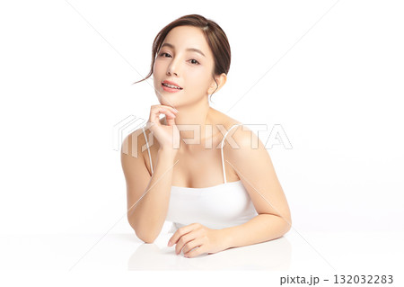 A beautiful young Asian woman with clean, fresh skin against a white background. Skincare, facial treatment, cosmetology, beauty, and spa. An elegant portrait of an Asian woman. A beautiful young Asian woman with clean, fresh skin against a white background. Skincare, facial treatment, cosmetology, beauty, and spa. An elegant portrait of an Asian woman. 132032283