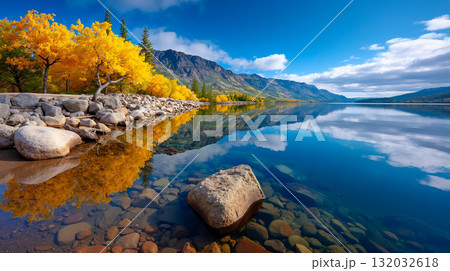 A lake with rocks and trees in the middle of it A lake with rocks and trees in the middle of it 132032618