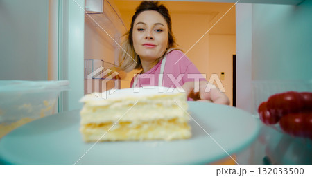 Women Looking For Food Inside Fridge In Kitchen while Pregnant. Women Looking For Food Inside Fridge In Kitchen while Pregnant. 132033500