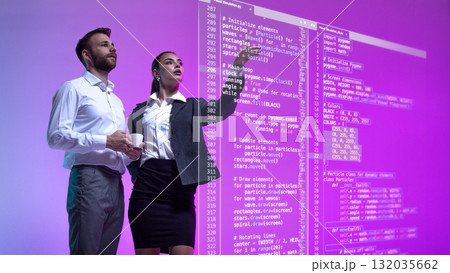 Creative digital artwork. Business team analyzing holographic programming interface in violet futuristic environment Creative digital artwork. Business team analyzing holographic programming interface in violet futuristic environment 132035662