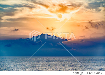 Beautiful orange sunrise sky over the sea horizon. Summer golden hour. Beautiful orange sunrise sky over the sea horizon. Summer golden hour. 132035847