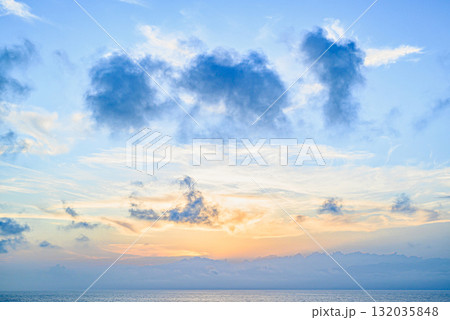 Beautiful orange sunrise sky over the sea horizon. Summer golden hour. Beautiful orange sunrise sky over the sea horizon. Summer golden hour. 132035848