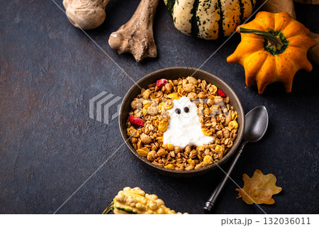 Halloween breakfast. Granola and ghost from yogurt 132036011