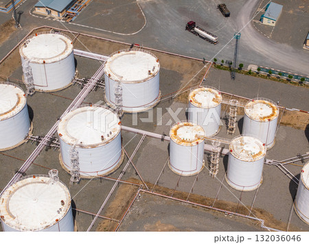 Aerial view of industrial storage tanks in petroleum facility 132036046