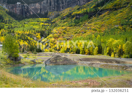 Emerald pond near Bridal veil trail with yellow aspen during fall foliage in Telluride, Colorado. Emerald pond near Bridal veil trail with yellow aspen during fall foliage in Telluride, Colorado. 132036251