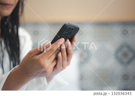 Woman using smartphone for communication and lifestyle technology concept Woman using smartphone for communication and lifestyle technology concept 132036343