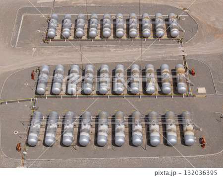 Industrial storage tanks at outdoor site during daytime 132036395