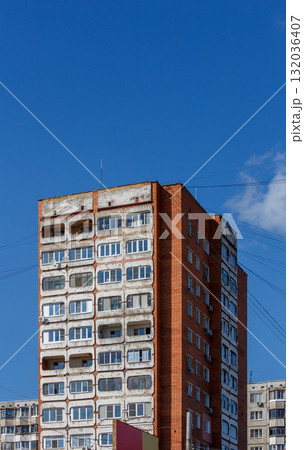 Stark soviet style apartment building with numerous windows and rounded balconies Stark soviet style apartment building with numerous windows and rounded balconies 132036407