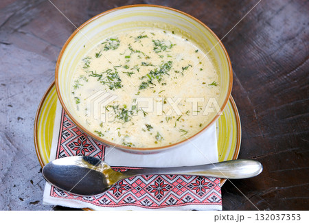 Closeup of plate of mushroom soup Soup bowl spoon mushroom soup with sour cream 132037353