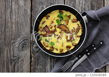 tasty porcini mushroom parmesan omelette, top view 132038384