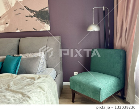 a modern bedroom in a stylish interior of a new apartment with designer renovation. High quality photo a modern bedroom in a stylish interior of a new apartment with designer renovation. High quality photo 132039230