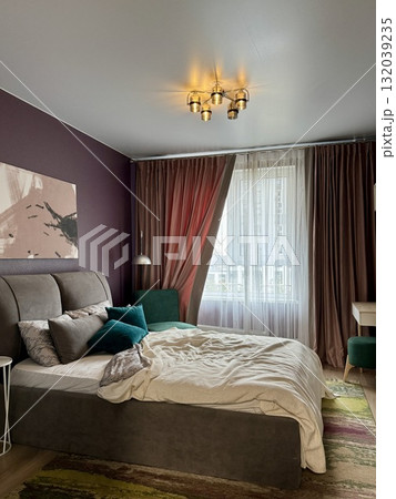 a modern bedroom in a stylish interior of a new apartment with designer renovation. High quality photo 132039235