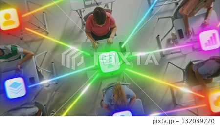 Boys and Girls Working on Desktops, Centrally Connected by Multi Colored Digital Lines 132039720