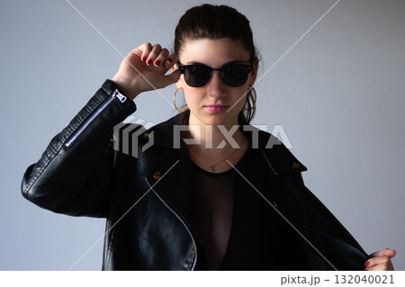 Half-length portrait of caucasian youn woman in urban style, perfect for fashion campaigns 132040021